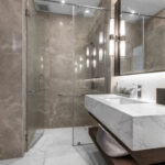 Clean and white bathroom with amenities.