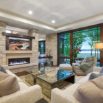A modern family room with a spectacular view of a lake
